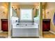 Elegant bathroom with a separate soaking tub and dual vanities at 697 Chapman, Jonesboro, GA 30238