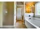 Serene bathroom featuring a large soaking tub and tasteful vanity lighting at 697 Chapman, Jonesboro, GA 30238