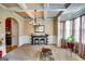 Dining room with a coffered ceiling, elegant chandelier, and a bar for entertaining at 697 Chapman, Jonesboro, GA 30238