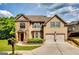 Charming two-story home with a manicured lawn, complemented by a two-car garage and classic brick accents at 697 Chapman, Jonesboro, GA 30238