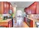 Well-appointed kitchen with stainless steel appliances and granite countertops with views to dining area at 697 Chapman, Jonesboro, GA 30238