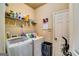 Well-equipped laundry room featuring modern appliances and shelving for ample storage at 697 Chapman, Jonesboro, GA 30238