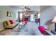 Bright living room featuring a stone fireplace, ceiling fan, and ample seating, creating a cozy and inviting atmosphere at 697 Chapman, Jonesboro, GA 30238