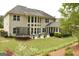 Beautiful backyard featuring a patio with lounge furniture and a trampoline at 6660 Canyon Cv, Cumming, GA 30028