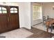 The entryway leads to the dining area, featuring hardwood floors, and a staircase at 6660 Canyon Cv, Cumming, GA 30028