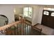 View from the upper level landing showing the home's entryway, front door, and sitting room at 6660 Canyon Cv, Cumming, GA 30028