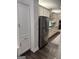Modern kitchen featuring stainless steel appliances, gray cabinets, and dark hardwood floors at 6660 Canyon Cv, Cumming, GA 30028