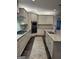Elegant kitchen with granite countertops, stainless steel appliances, and stylish lighting at 6660 Canyon Cv, Cumming, GA 30028