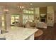 Inviting living area showcasing a two-story brick fireplace, built-ins, and natural light at 6660 Canyon Cv, Cumming, GA 30028