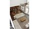 Open-concept living space with hardwood floors, modern furnishings, and abundant natural light at 6660 Canyon Cv, Cumming, GA 30028