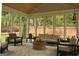 Beautiful sunroom featuring comfortable seating, natural light, and scenic views at 6660 Canyon Cv, Cumming, GA 30028