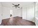 Clean bedroom with hardwood floors and a ceiling fan, offering comfort and style at 1 Lamar Ave Sw, Atlanta, GA 30310