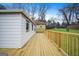 Spacious wooden deck, perfect for outdoor gatherings and relaxation overlooking a well-maintained lawn at 1 Lamar Ave Sw, Atlanta, GA 30310
