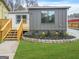 Charming home exterior with a new deck, manicured lawn, and colorful flowerbed at 1 Lamar Ave Sw, Atlanta, GA 30310