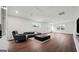 Bright, spacious living room with hardwood floors, large windows, and modern furniture at 1 Lamar Ave Sw, Atlanta, GA 30310