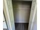 A bedroom closet with bi-fold doors and a shelf ready for storage at 194 Bay Court Dr, Stockbridge, GA 30281