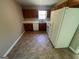 Functional kitchen with oak cabinets, tile flooring, and ample countertop space for meal prep at 194 Bay Court Dr, Stockbridge, GA 30281