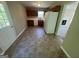 Well-lit kitchen featuring oak cabinets, white appliances, and vinyl floors at 194 Bay Court Dr, Stockbridge, GA 30281
