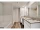 Spacious bathroom featuring a double vanity with granite countertops and a shower/tub combo at 1184 Bluecoat Cir # 84, Hampton, GA 30228