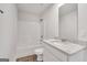 Bathroom with a white vanity, granite countertop, and a shower/tub combo, featuring wood look flooring at 1184 Bluecoat Cir # 84, Hampton, GA 30228