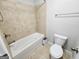 Bathroom with white toilet, shower, and tub at 206 Birchin Dr, Woodstock, GA 30188