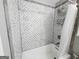 The bathroom showcases tiled shower and a shower head at 206 Birchin Dr, Woodstock, GA 30188