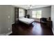 Bedroom with a Murphy bed, hardwood floors, and office space at 206 Birchin Dr, Woodstock, GA 30188
