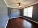 Bedroom features hardwood floors, natural light, and a ceiling fan at 206 Birchin Dr, Woodstock, GA 30188