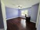 This bedroom features beautiful hardwood floors and a ceiling fan at 206 Birchin Dr, Woodstock, GA 30188