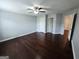 This bedroom features hardwood floors, a ceiling fan, and two closets at 206 Birchin Dr, Woodstock, GA 30188