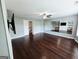 Spacious bonus room featuring dark floors, large mirror, and a ceiling fan at 206 Birchin Dr, Woodstock, GA 30188