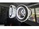 Modern ringed chandelier shines brightly in the foyer, set against hardwood floors and natural light at 206 Birchin Dr, Woodstock, GA 30188