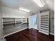 Spacious walk-in closet with custom shelving and storage; entrance to the primary bath at 206 Birchin Dr, Woodstock, GA 30188