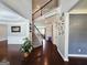 Grand two-story foyer features hardwood floors, staircase, and elegant decorative details at 206 Birchin Dr, Woodstock, GA 30188