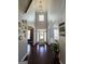 Elegant two-story foyer with hardwood floors, decorative mirrors, and plenty of natural light at 206 Birchin Dr, Woodstock, GA 30188