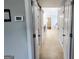 Hallway featuring tile flooring, and doors leading to other parts of the home at 206 Birchin Dr, Woodstock, GA 30188