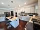 Well-equipped kitchen featuring an island with barstool seating, modern appliances, and ample counter space at 206 Birchin Dr, Woodstock, GA 30188
