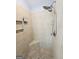 Tiled walk-in shower with dual shower heads, bench, and tiled storage niche at 206 Birchin Dr, Woodstock, GA 30188