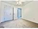 Spacious bedroom features neutral walls, plush carpeting, and ample closet space at 121 Pinnacle Ln, Mcdonough, GA 30253