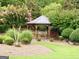 Picturesque gazebo nestled within a beautifully landscaped garden area with lush greenery at 121 Pinnacle Ln, Mcdonough, GA 30253