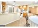 Charming kitchen with wooden cabinets, modern appliances, and a breakfast bar at 121 Pinnacle Ln, Mcdonough, GA 30253