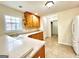 Traditional kitchen features wooden cabinets, granite countertops, and tile flooring at 121 Pinnacle Ln, Mcdonough, GA 30253