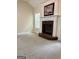 Cozy living room features a classic fireplace, soft carpet, and natural light at 121 Pinnacle Ln, Mcdonough, GA 30253