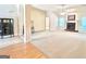 Spacious living room with a cozy fireplace and abundant natural light through large windows at 121 Pinnacle Ln, Mcdonough, GA 30253