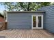 Charming backyard showcasing a wooden deck and the home's exterior at 1675 Brewer Sw Blvd, Atlanta, GA 30310