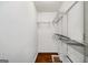 Spacious walk in closet with metal racks and hardwood floors at 1675 Brewer Sw Blvd, Atlanta, GA 30310