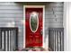 Inviting red front door with decorative glass and white trim offers a warm welcome to the home at 1675 Brewer Sw Blvd, Atlanta, GA 30310