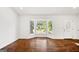 Spacious living room featuring bay windows, hardwood floors and ample light at 1675 Brewer Sw Blvd, Atlanta, GA 30310