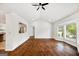Bright living room with hardwood floors, open layout, and windows that let in natural light at 1675 Brewer Sw Blvd, Atlanta, GA 30310