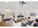 Bright open concept living room features hardwood floors and views into kitchen with breakfast bar at 1675 Brewer Sw Blvd, Atlanta, GA 30310